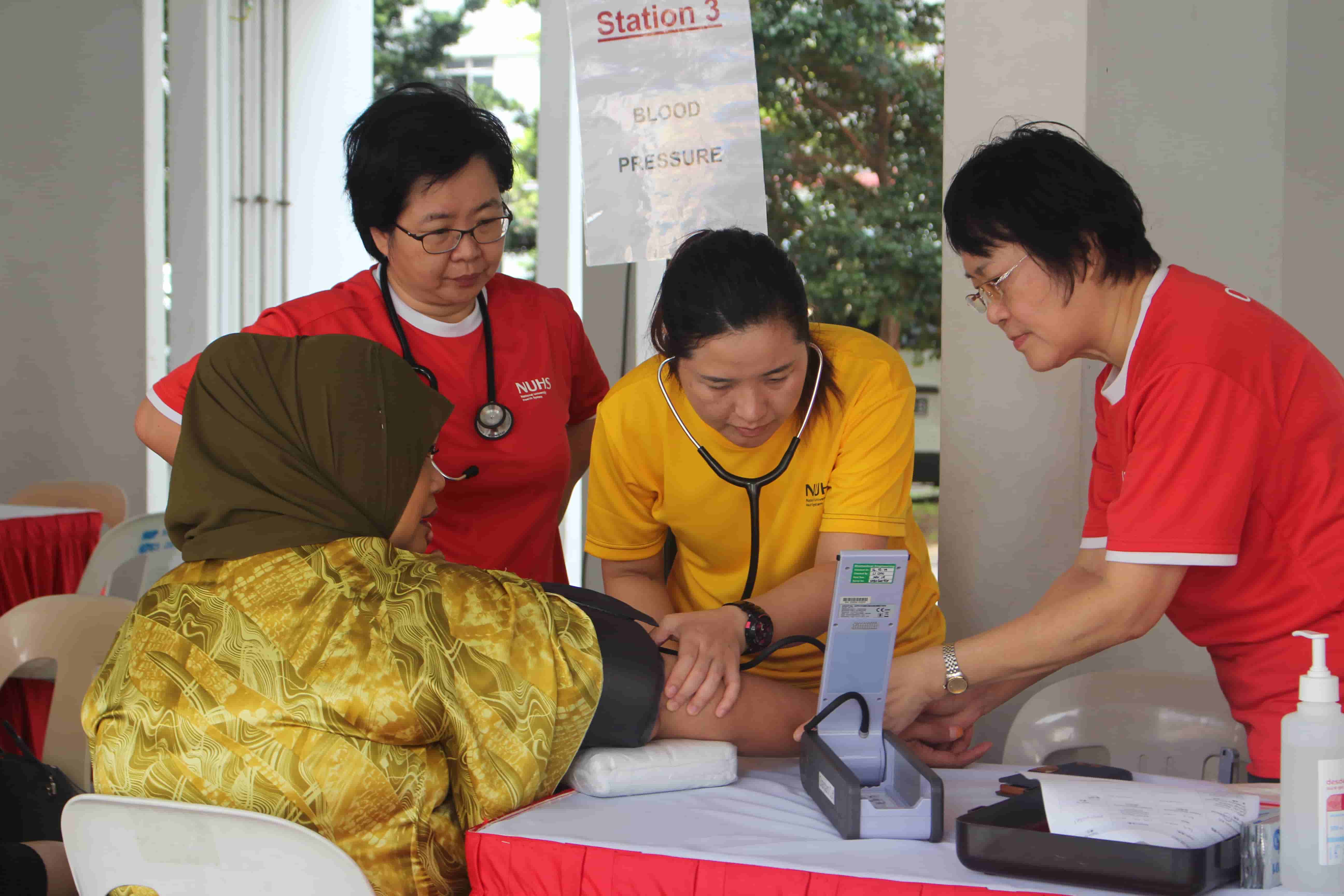 Volunteers checking blood pressure